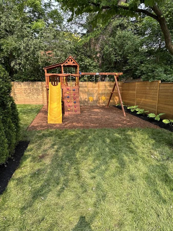 Backyard fence and outdoor play space