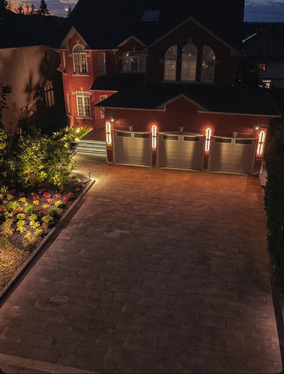 New interlocking driveway with lighting at night