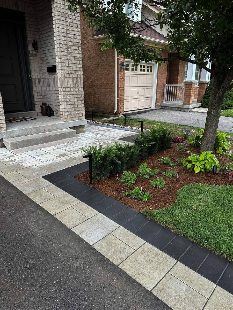 New walkway with slab border and planted bed