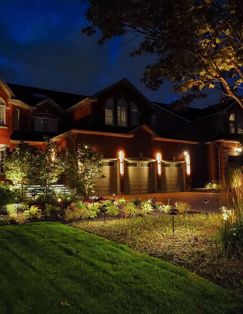 Front yard garden lit at night