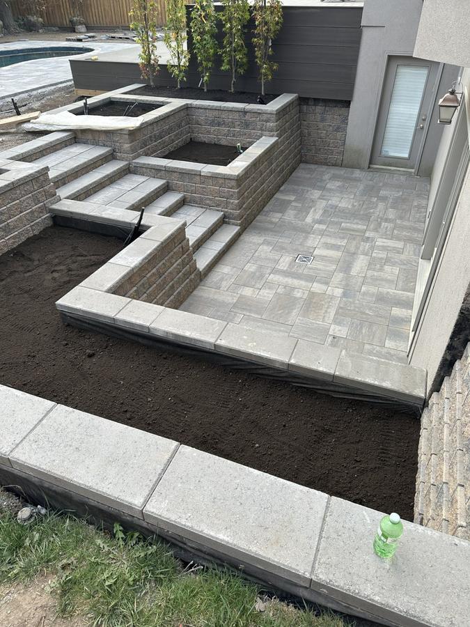 Patio with raised planters under construction