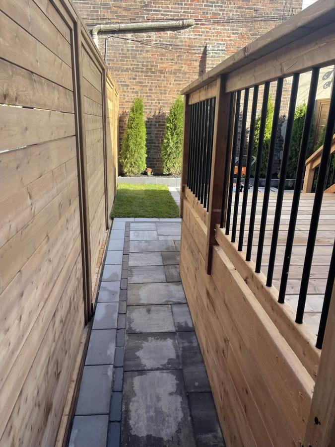 Custom wood fence and paver walkway